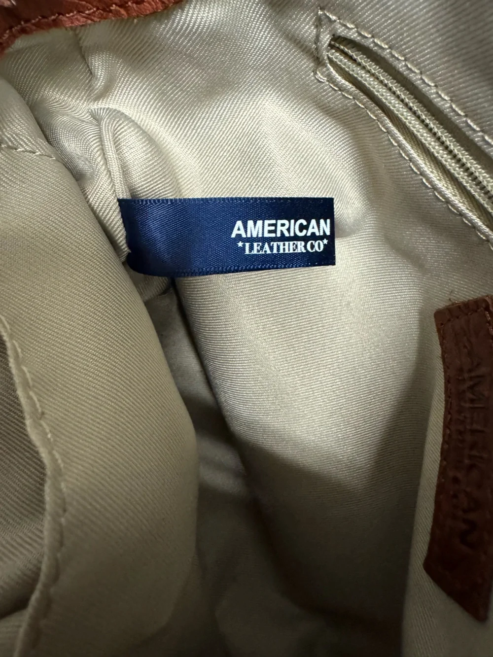 American Leather Co. compact embossed
